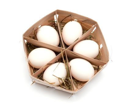 eggs in eco box. Isolated on white background. Top view.