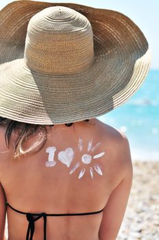 Sun Protection, girl using sunscreen  to safe her skin healthy