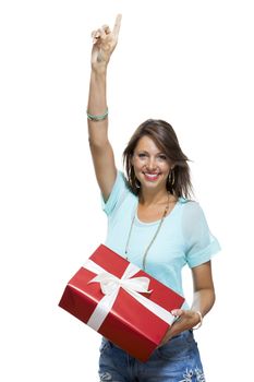 Close up Portrait of Happy Young Woman in Casual Clothing Holding a Red Big Gift Box with White Ribbon While Looking at the Camera. Isolated on White Background.