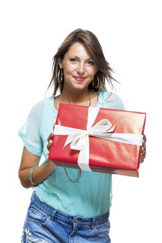 Close up Portrait of Happy Young Woman in Casual Clothing Holding a Red Big Gift Box with White Ribbon While Looking at the Camera. Isolated on White Background.