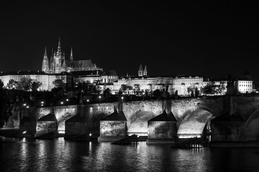 St. Vitus Cathedral and Charles bridge at night, Prague, Czech Republic. Black and white.