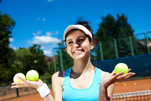 Young woman playing tennis, summertime saturated theme