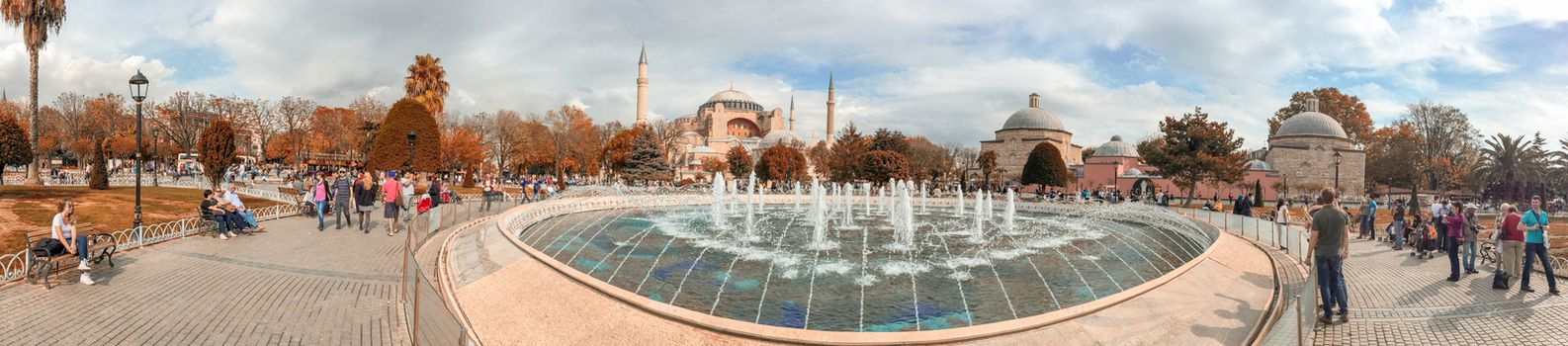 ISTANBUL - SEPTEMBER 21, 2014: Tourists enjoy city life in Sultanahmet Park. Istanbul attracts more than 10 million every year.