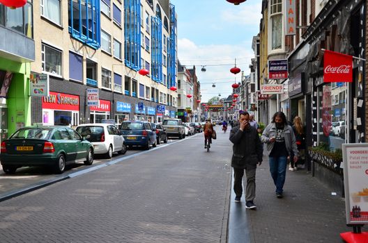 The Hague, Netherlands - May 8, 2015: People visit China town in The Hague on May 8, 2015. The Hague's Chinatown is located in the city centre, on the Wagenstraat.