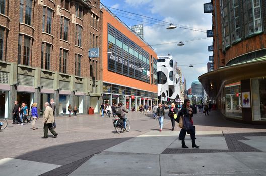 The Hague, Netherlands - May 8, 2015: People shopping on venestraat shopping street in The Hague, Netherlands. on  May 8, 2015. The Hague is the capital city of the province of South Netherlands. With a population of 515,880 inhabitants.