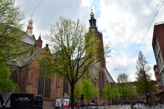 The Hague, Netherlands - May 8, 2015: People at Grote of Sint-Jacobskerk (Big Church). Grote of Sint-Jacobskerk is a landmark Protestant church in The Hague, Netherlands.