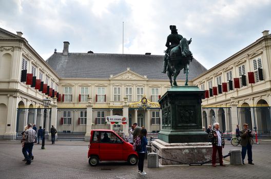 The Hague, Netherlands - May 8, 2015: People visit Noordeinde Palace, the Hague, Netherlands. Hague is the capital of the province South Netherlands.on May 8, 2015.