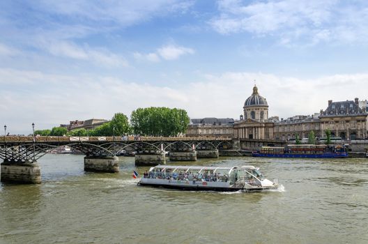 Institut de France and the Pont des Arts bridge across river Seine in Paris, France.