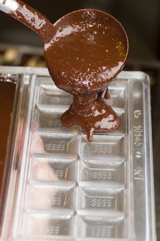 Mixed chocolate poured on bar mold
