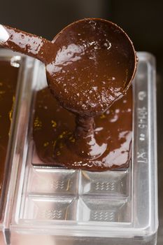 Mixed chocolate poured on bar mold