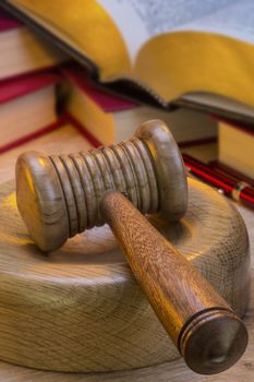 A gavel is a small ceremonial mallet which an auctioneer, a judge, or the chair of a meeting hits a surface to call for attention or order.