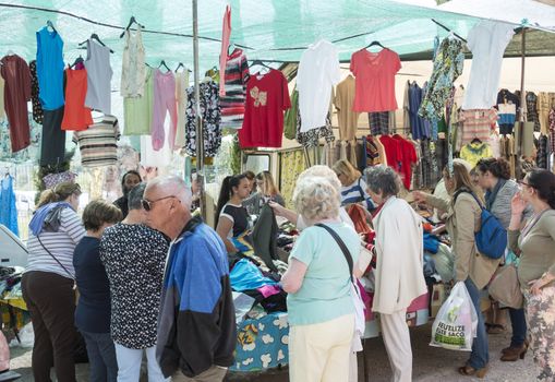 LOULE,PORTUGAL - APRIL 22: Local people sell their staff at the market on April 22, 2015 in Loule, Portugal,this is an anual market aranged by roman families
