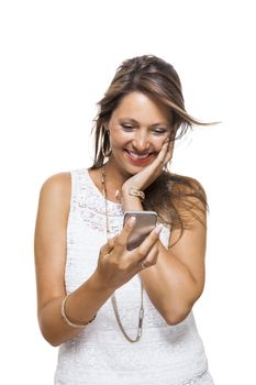Vivacious attractive woman reacting to a text message on her mobile phone flicking her hair in the air and staring at the phone with her mouth open, on white with copyspace