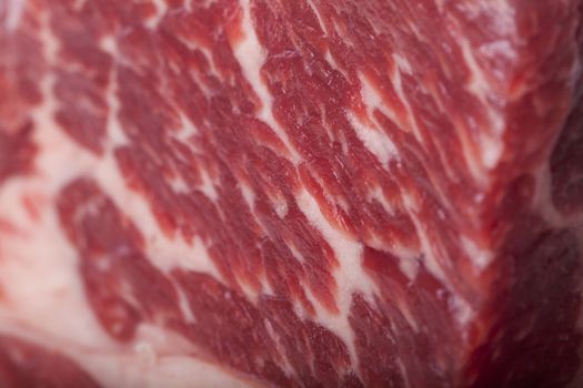 Fresh Slice of Protein Rich Raw Beef Meat on Top of the Table on White Background