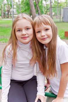 Photo of two cute girls with long hairs