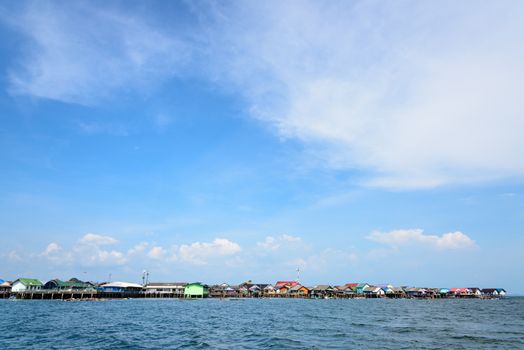 Blue sky background above fisherman village on the sea at Koh Panyee or Punyi island cultural attractions travel by boat in Phang Nga Bay or Ao Phang Nga National Park, Thailand