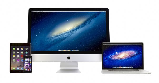 Galati, Romania - February 26, 2014: Apple iMac 27 inch desktop computer, Macbook Pro, iPad Air 2 and iPhone 6 on white background. All devices displaying home screen and produced by Apple Inc.
