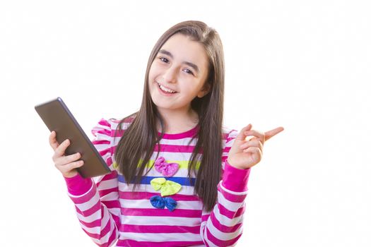 beautiful teenager girl in casual clothes with backpack holding digital tablet in her hand