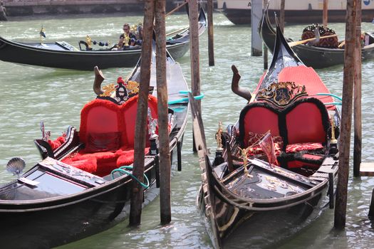 The Venice gondolas await tourists
