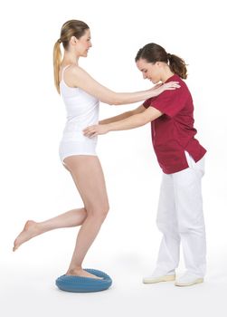 Physiotherapist doing a proprioceptive rehabilitation