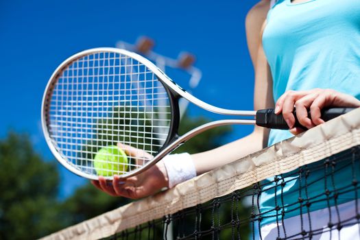 Woman playing tennis, summertime saturated theme