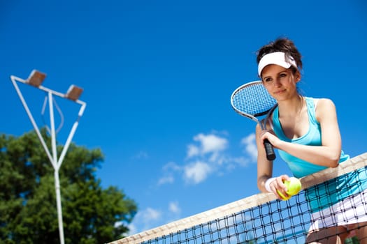 Woman playing tennis, summertime saturated theme