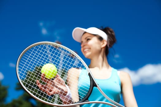 Woman playing tennis, summertime saturated theme