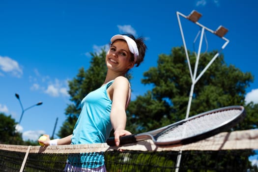 Woman playing tennis, summertime saturated theme