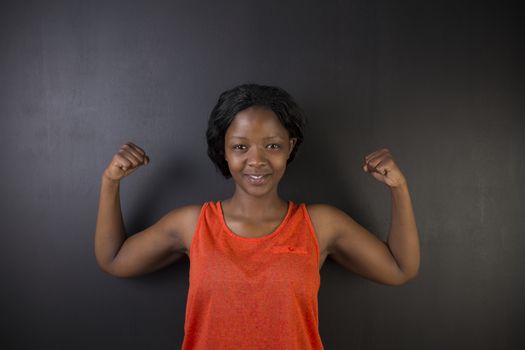 South African or African American woman teacher with healthy strong arm muscles for success
