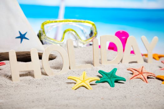 Colorful plastic toys on the beach