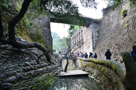 Chandigarh, India - January 4, 2015: Tourist visit Rock statues at the rock garden on January 4, 2015 in Chandigarh, India. The rock garden was founded by artist Nek Chand in 1957 and is made completely of recycled waste.