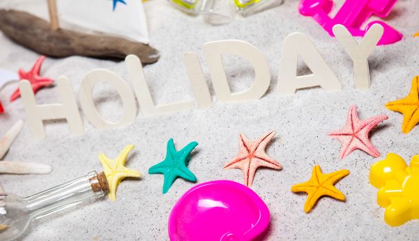 Colorful plastic toys on the beach