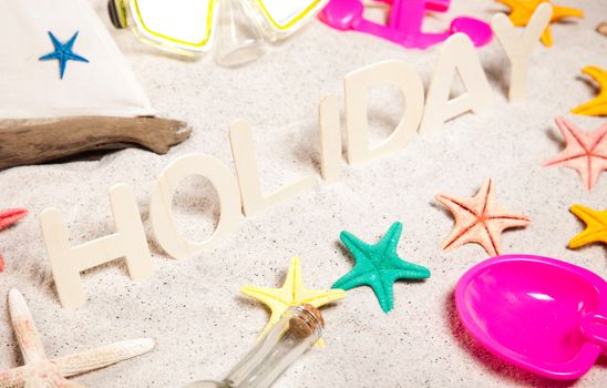 Colorful plastic toys on the beach