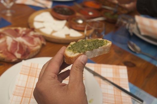 slice of bread with green sauce mojo