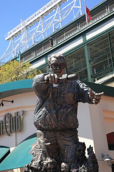 Harry Caray statue at the corner of Addison Street and Sheffield Avenue, famous address for Wrigley Field, home ballpark of the Chicago Cubs.