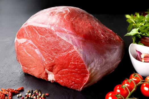 Raw meat. Uncooked fresh pork and beef. Red meat grilled barbecue grill in black stone background