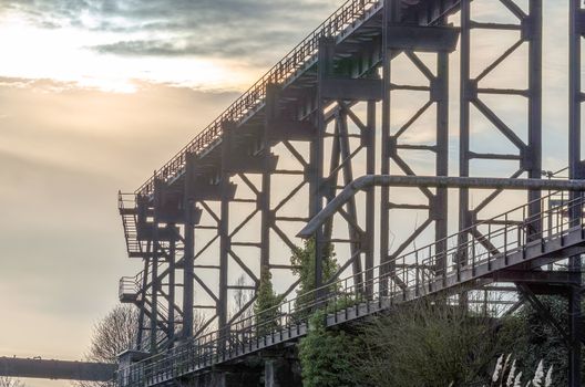 Overlooking the track trail in the Landscape Park Duisburg Nord with dramatic sky.