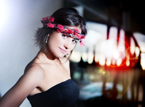 beauty and fashion concept. Beautiful fashionable young woman with city lights background. Urban fashion with backlight