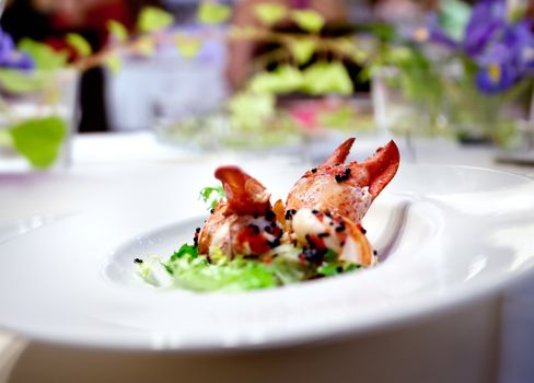 Festive meal. Restaurant lobster dish floral arrangement. Modern food for celebrations