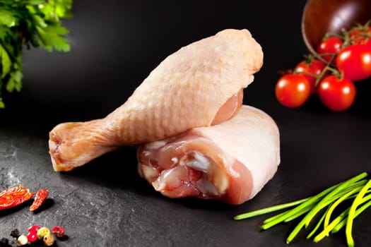Fresh and raw meat. Raw chicken thighs white  ready to cook. Background black blackboard. Food