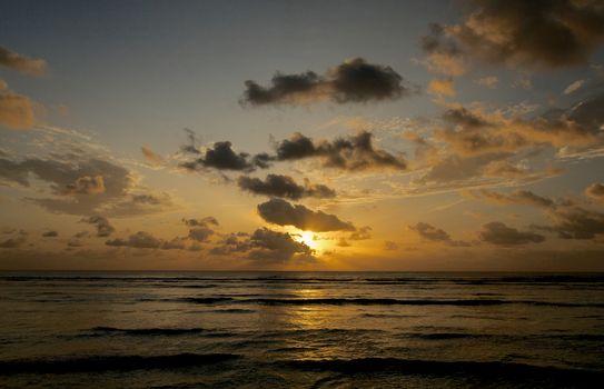 Beautiful Cloudy Sunrise over Indian Ocean Waves Outdoors