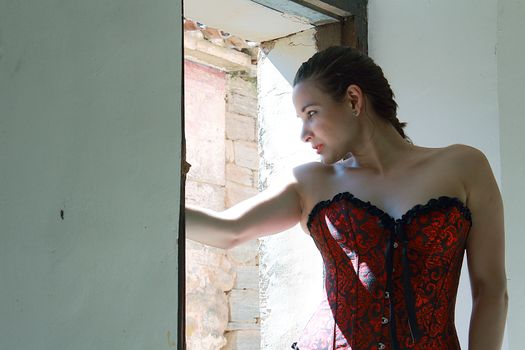 woman posing in ruined house