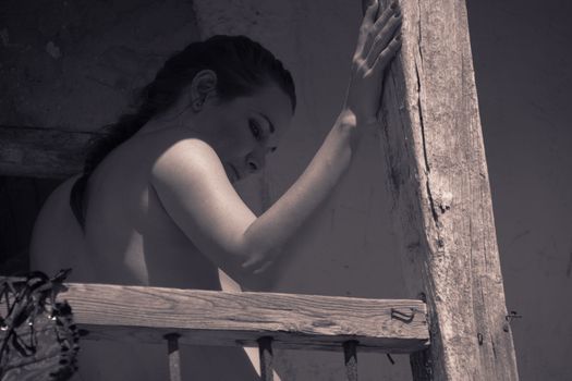 woman posing in ruined house