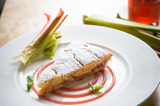 delicious rhubarb cake on white plate. sweet food
