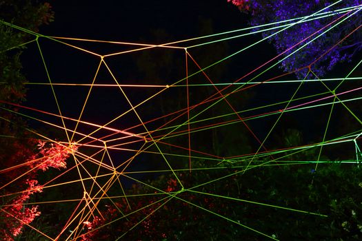 SYDNEY, AUSTRALIA - MAY 27, 2015;  Our House comprises hundreds of metres of light-emitting rope tied together to form a giant overhead web., throughout the garden in the park  at Circular Quay.   Artist: Tom Dekyvere of Denmark