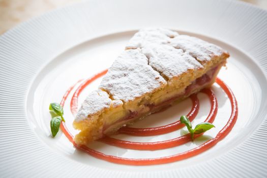 delicious rhubarb cake on white plate. sweet food