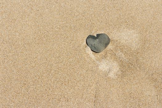 A heart in the sand to symbolise love