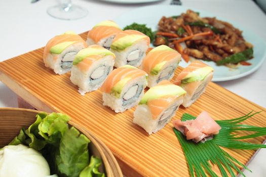 salmon sushi on wooden plate  medium shot








salmon sushi on wooden plate
