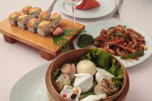 menu of sushi and wontons in wooden bowl and fried vegetables