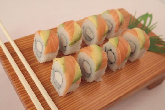 sushi on wooden plate